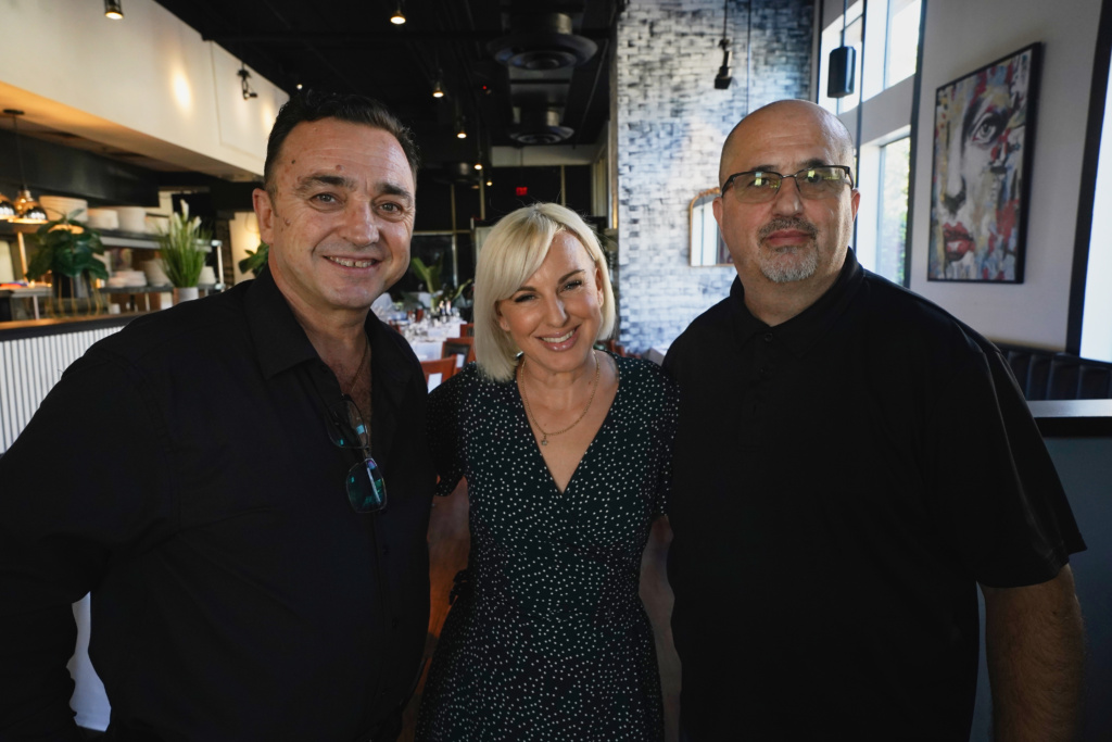 Three people posing inside SOHO during the Kickin’ It Local feature