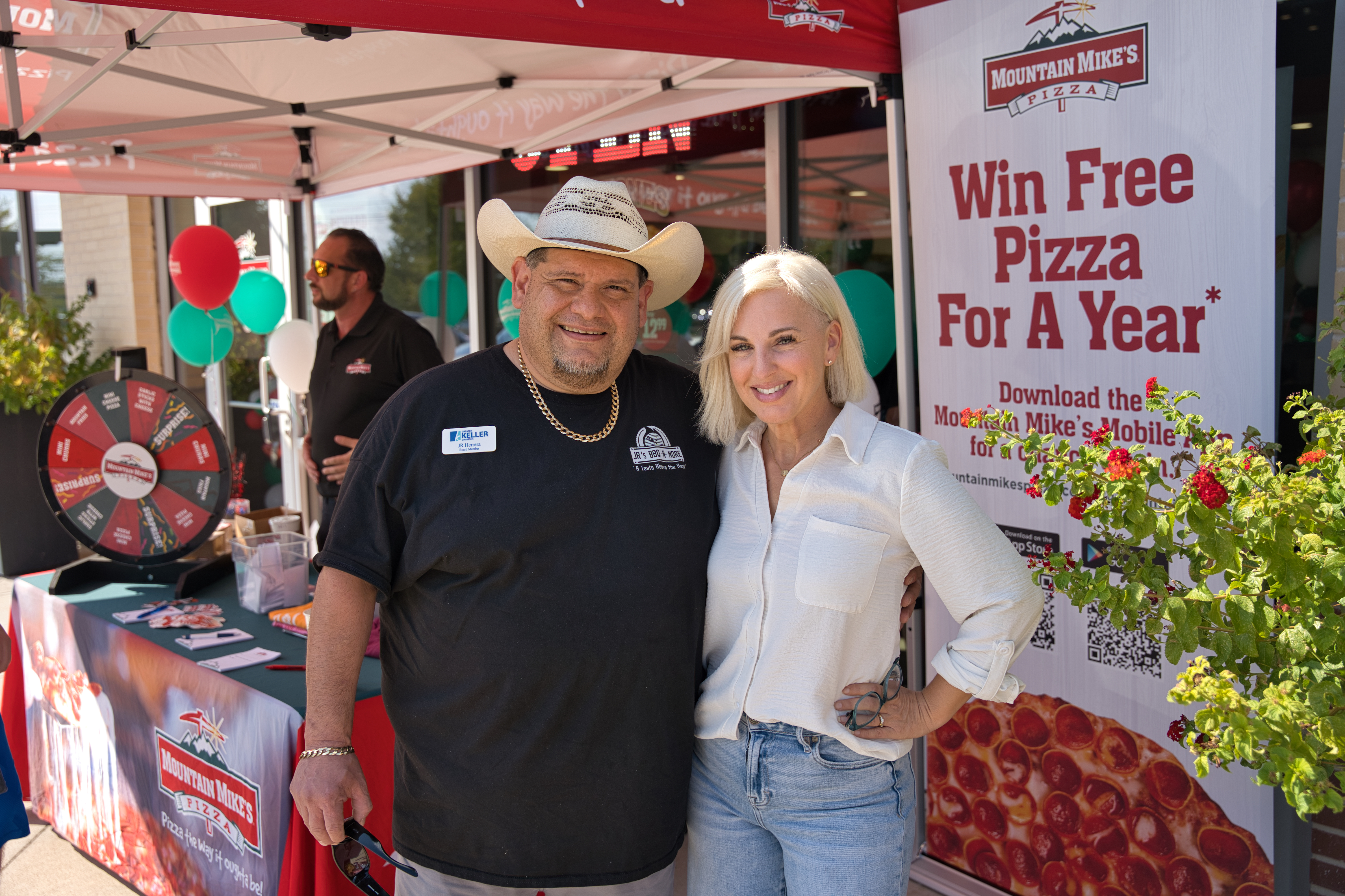 Ashley Hernandez of Kickin’ It Media Group with JR of JR’s BBQ N MORE at the Mountain Mike’s Pizza Keller grand reopening