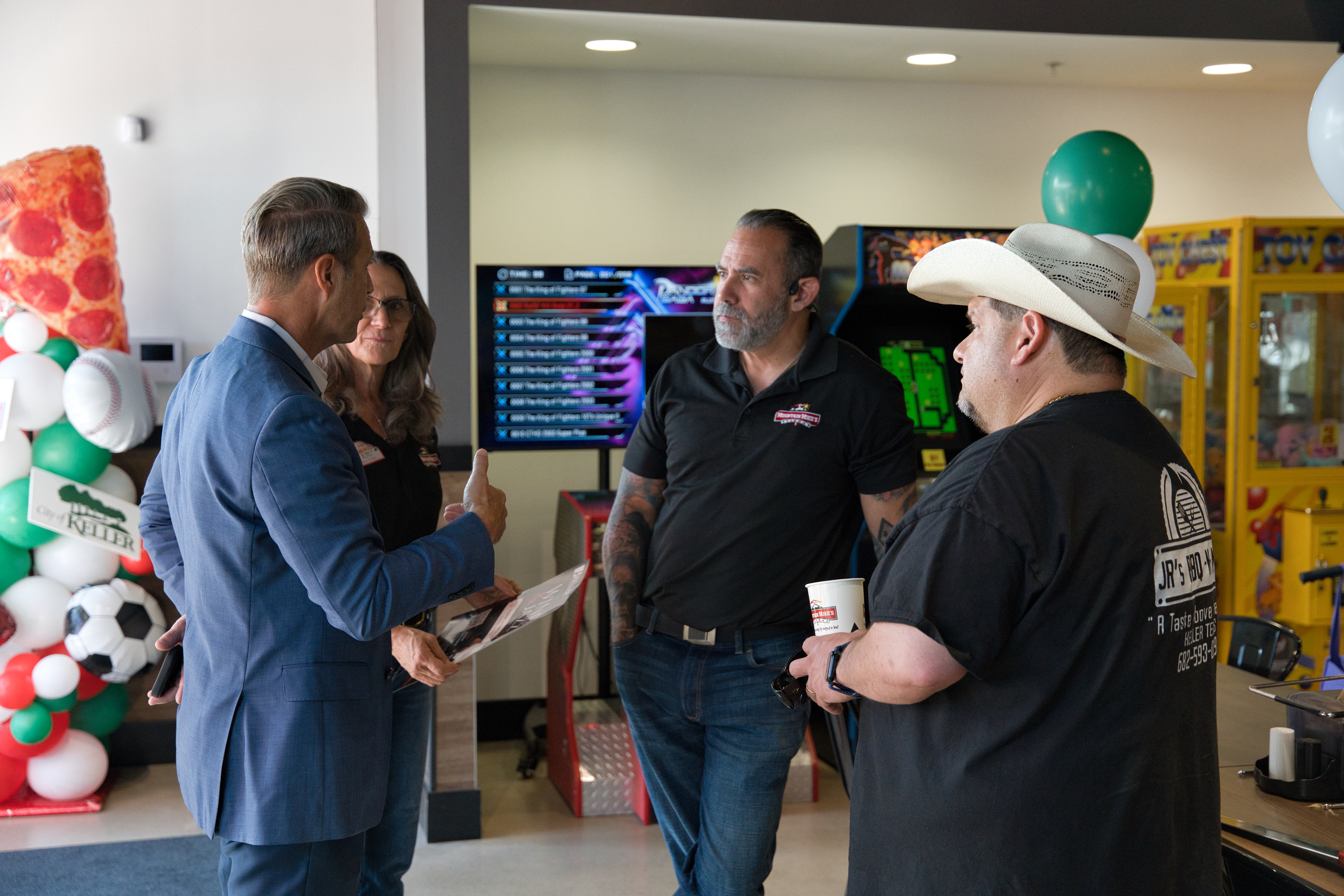 Keller leaders and community members connecting inside Mountain Mike’s Pizza during the grand reopening