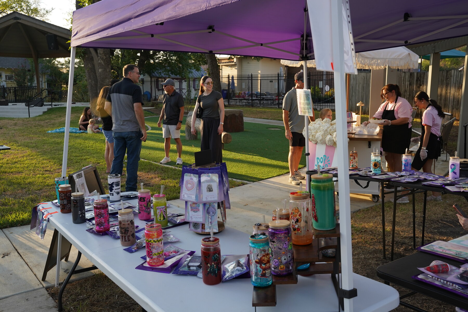 Handmade goods and conversations under the vendor tents.