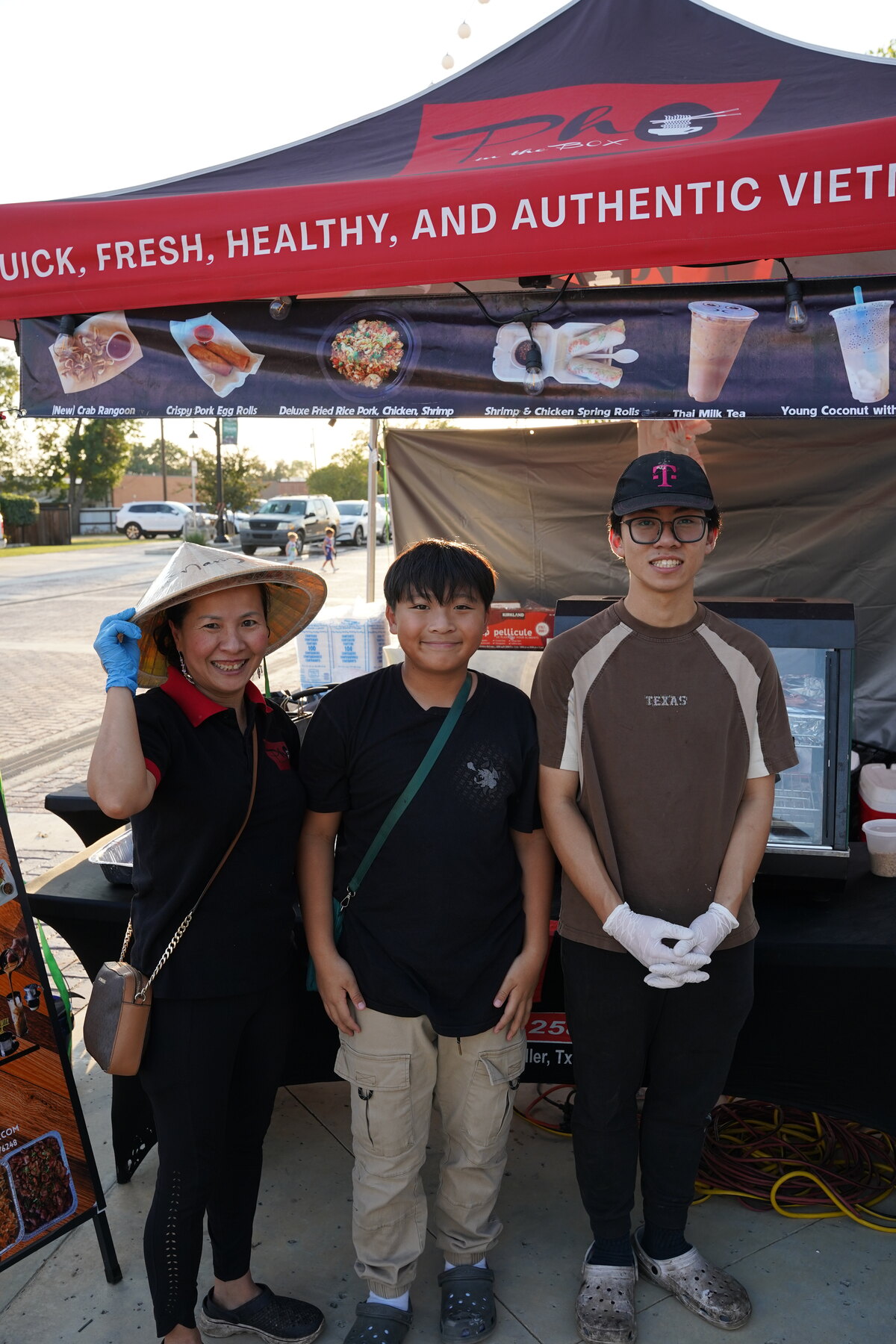 Faces behind one of the evening’s food tents.